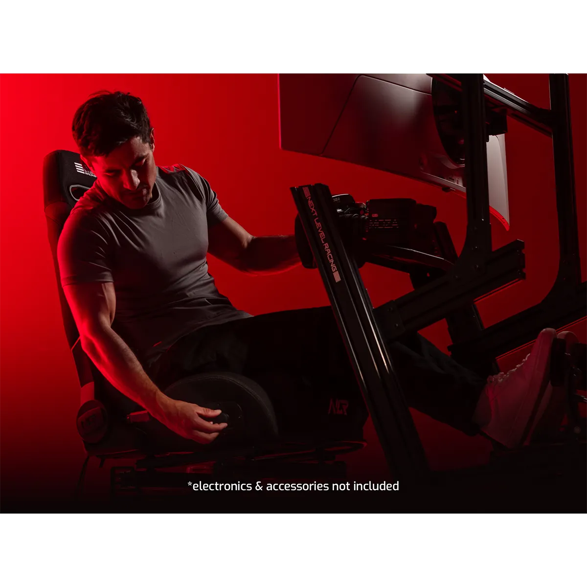 Next Level Racing ERS3 haptic sim racing seat in use with racing cockpit setup